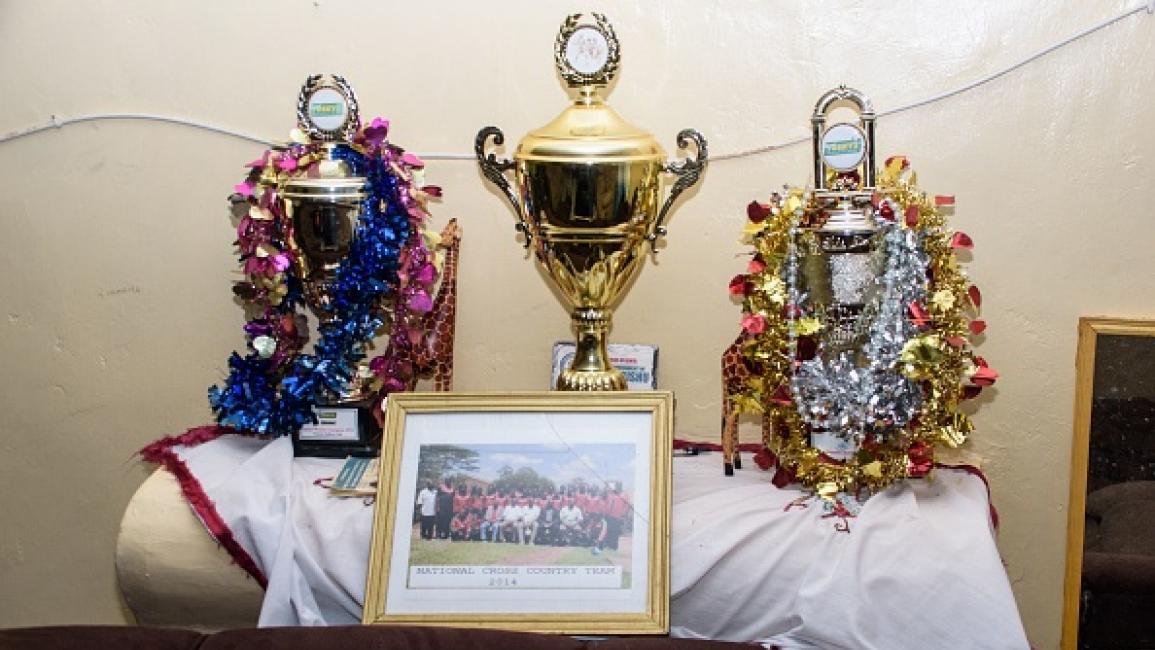 This photograph taken on October 16, 2021 shows trophies of Kenyan distance runner Agnes Tirop who was found dead with stab wounds to her stomach at her home are displeyed at her mother's home in Kapnyemisa, some 300kms north-west of Nairobi. - Tirop, 25, was a fast-rising athlete -- a double world 10,000m bronze medallist and 2015 world cross county champion who also finished fourth in the 5,000m at the Tokyo Olympics this year. The husband of Tirop was arrested following a dramatic late-night chase in the