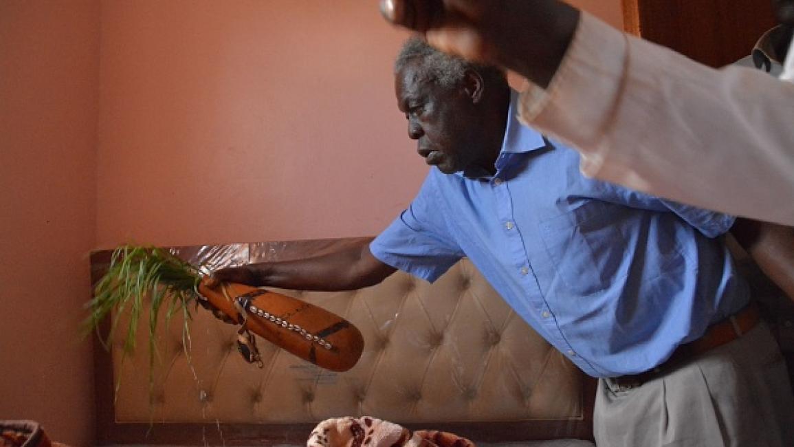 Uncles of Agnes Tirop, Kenyan distance runner who was found dead with stab wounds at home, perform the traditional cleansing ritual at the crime scene of Tirop's home in Iten, Kenya, on October 18, 2021. - Tirop, 25, was a fast-rising athlete -- a double world 10,000m bronze medallist and 2015 world cross county champion who also finished fourth in the 5,000m at the Tokyo Olympics this year. (Photo by Casmir ODUOR / AFP) (Photo by CASMIR ODUOR/AFP via Getty Images)