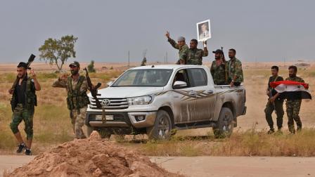 جنود تابعون للنظام السوري في الرقة 2019 (Getty)
