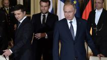 الرئيس الروسي مع نظيريه الفرنسي والأوكراني (أليكسي نيكولسكي/ فرانس برس)
