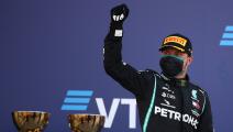 Mercedes' Finnish driver Valtteri Bottas celebrates on the podium after winning the Formula One Russian Grand Prix at the Sochi Autodrom Circuit in Sochi on September 27, 2020. (Photo by Bryn Lennon / POOL / AFP) (Photo by BRYN LENNON/POOL/AFP via Getty Images)
