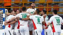 Algeria's players celebrate their win in the 2021 World Men's Handball Championship between Group F teams Algeria and Morocco at the New Capital Sports Hall in the Egyptian capital Cairo on January 14, 2021. (Photo by Khaled ELFIQI / POOL / AFP) (Photo by KHALED ELFIQI/POOL/AFP via Getty Images)