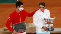 PARIS, FRANCE - OCTOBER 11: Runner-up Novak Djokovic of Serbia (L) and winner Rafael Nadal of Spain pose with their respective trophies following their Men's Singles Final on day fifteen of the 2020 French Open at Roland Garros on October 11, 2020 in Paris, France. (Photo by Clive Brunskill/Getty Images)	