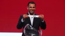 DOHA, QATAR - APRIL 27: Younis Mahmoud of Iraq holds out the name for Iraq as he helps with the draw during the FIFA Arab Cup Qatar 2021 Official Draw at Katara Opera House on April 27, 2021 in Doha, Qatar. (Photo by Mohamed Farag - FIFA/FIFA via Getty Images)	