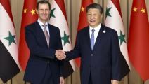 الرئيس الصيني شي جين بينغ والسوري بشار الأسد (أسوشيتدبرس)