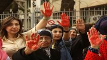 LEBANON-WOMEN-CRIME-DEMO Lebanese women flash the palm of their hands colored in red as they demonstrate against prostitution, sex slavery and violence against women in front of the Justice Palace in the capital Beirut on April 8, 2016. / AFP / PATRICK BAZ (Photo credit should read PATRICK BAZ/AFP via Getty Images)