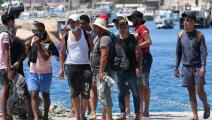 مهاجرون تونسيون وصلوا إلى إيطاليا (ألبيرتو بيزولي/ فرانس برس)