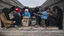 TOPSHOT-SYRIA-CONFLICT-IS TOPSHOT - Women and children who fled the Islamic State (IS) group's embattled holdout of Baghouz on February 14, 2019, wait in the back of a truck in the eastern Syrian province of Deir Ezzor. - IS jihadists using tunnels and suicide bombers were mounting a desperate defence today of their last square kilometre in eastern Syria. Kurdish-led forces closed in on the small town of Baghouz where IS fighters and their relatives were hunkered down and met famished and dishevelled people