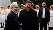 الرئيس الصيني شي مع نظيره الإيراني روحاني لدى زيارته إلى طهران في 2016 (Getty)