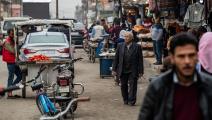 سوريون في سوق في محافظة الحسكة (دليل سليمان/ فرانس برس)