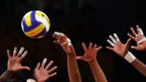 ATHENS - AUGUST 26: Players hands reach for the ball at the net during the China v Cuba women's indoor Volleyball semifinal match on August 26, 2004 during the Athens 2004 Summer Olympic Games at the Peace and Friendship Stadium part of the Faliro Coastal Zone Olympic Complex in Athens, Greece. (Photo by Scott Barbour/Getty Images) *** Local Caption ***