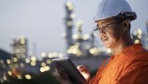 Engineer checks shipment of chemicals at oil and gas industry pipeline job site. - stock photo Engineer checks shipment of chemicals at oil and gas industry pipeline job site.