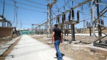A Syrian elctricity company employee is pictured in main power distribution facilities in the rebel-held northwestern city of Idlib on June 6, 2021. - Connection to Turkish power has been life-changing for many in Idlib city and the wider region, who have had no reliable supply since Damascus pulled the plug after the area was overrun by rebels in 2012. (Photo by OMAR HAJ KADOUR / AFP) (Photo by OMAR HAJ KADOUR/AFP via Getty Images)