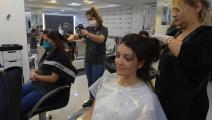 Beauty trade penetrates hairdressing salon in Tunisia (Fethi Belaid / AFP)