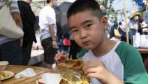 ترتبط أمراض مزمنة لدى أطفال في الصين بزيادة الوزن والسمنة (هو يو/ Getty) 