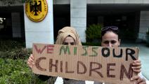 مطالبة بلم الشمل بالأبناء اللاجئين إلى ألمانيا أمام القنصلية الألمانية في اليونان (ساكيس متروليديس/فرانس برس)