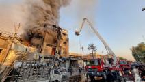 حريق في مبنى يضم مخازن عطور في بغداد (مرتضى السوداني/ الأناضول)