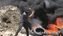 احراق الإطارات خلال مظاهرة في الضفة الغربية (ناصر اشتيه/Getty)