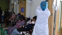 مصابون بكورونا في مستشفى في الصين (شلدون كوبر/ Getty)