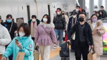 مسافرون في محطة قطار في الصين (سو يانغ/ Getty)