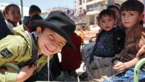 أطفال سوريون في إدلب في عيد الأضحى (عمر حاج قدور/ فرانس برس)