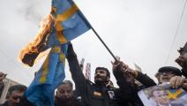 أحرجت أزمة السماح بحرق القرآن علاقات السويد مع العالم الإسلامي (مرتضى نيكوبازل/ Getty)