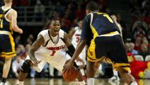 LOUISVILLE, KY - JANUARY 10: Terrence Williams #1 of the Louisville Cardinals puts defensive pressure on Da'Sean Butler #1 of the West Virginia Mountaineers during the Big East Conference game against on January 10, 2008 at Freedom Hall in Louisville, Kentucky. (Photo by Andy Lyons/Getty Images)