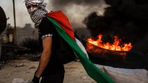من الاحتجاجات الفلسطينية في بيت إيل في رام الله على جرائم الاحتلال المتواصلة في قطاع غزة (ماركوس يام/Getty)