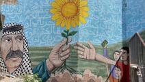 عمل للفنّان الفلسطيني كريس غزالة على جدار مدرسة في حيّ سلوان المقدسي، 2022