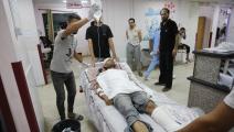 المرضى والجرحى يعانون في مستشفيات القطاع (أشرف أبو عمرة/ الأناضول)