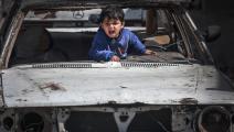 	 طفل فلسطيني داخل سيارة دمرت بقصف الاحتلال، مخيم رفح للاجئين، 21 آذار/ مارس، 2024 (Getty)