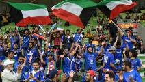 Fans of Kuwait wave their national flags before the first round Asian Cup football match between Australia and Kuwait in Melbourne on January 9, 2015. AFP PHOTO / WILLIAM WEST IMAGE RESTRICTED TO EDITORIAL USE - STRICTLY NO COMMERCIAL USE (Photo credit should read WILLIAM WEST/AFP via Getty Images)