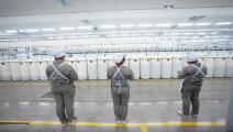 يعمل الأويغور في المصانع الصينية قسريا (Getty)