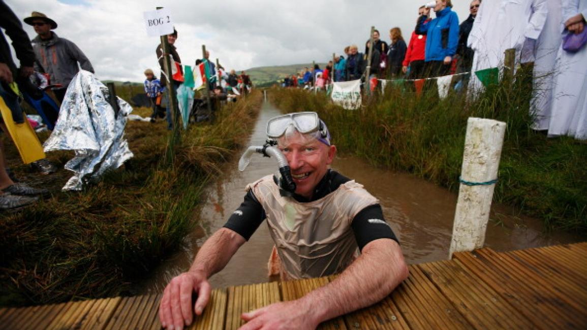 LLANWRTYD WELLS, WALES - AUGUST 28: A competitor prepares to snorkle during the World Bog Snorkelling Championships on August 28, 2011 in Llanwrtyd Wells, Wales. In 2012, following the Olympic Games, Llanwrtyd Wells will host the inaugural World Alternative Games. (Photo by Harry Engels/Getty Images)	