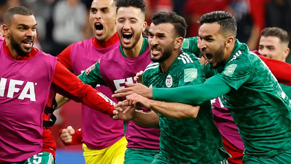 Algeria's forward Amir Sayoud (C) celebrates with teammates after scoring the opening goal during the FIFA Arab Cup 2021 final football match between Tunisia and Algeria at the Al-Bayt stadium in the Qatari city of Al-Khor on December 18, 2021. (Photo by JACK GUEZ / AFP) (Photo by JACK GUEZ/AFP via Getty Images)