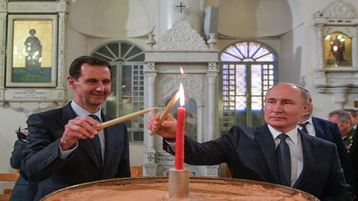 بوتين وبشار الأسد في كنيسة في دمشق 7/1/2020 (Getty)