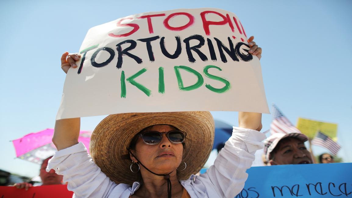 أوقفوا تعذيب الأطفال/مجتمع (ماريو تاما/ Getty)