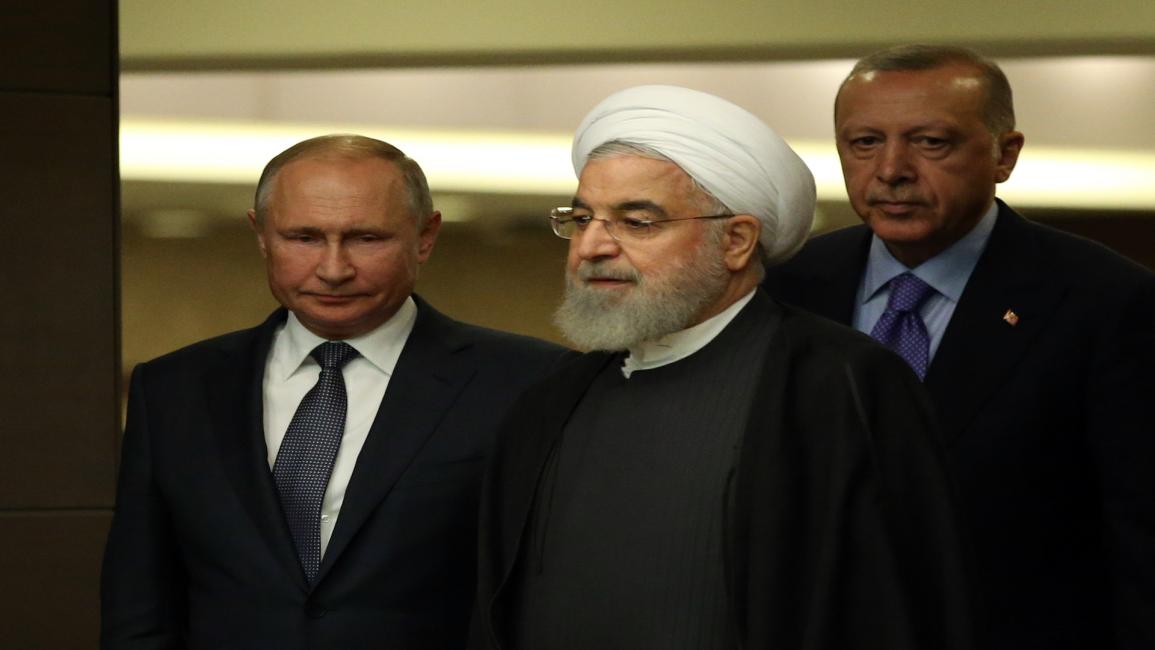 أردوغان روحاني بوتين (Mikhail Svetlov/Getty Images)