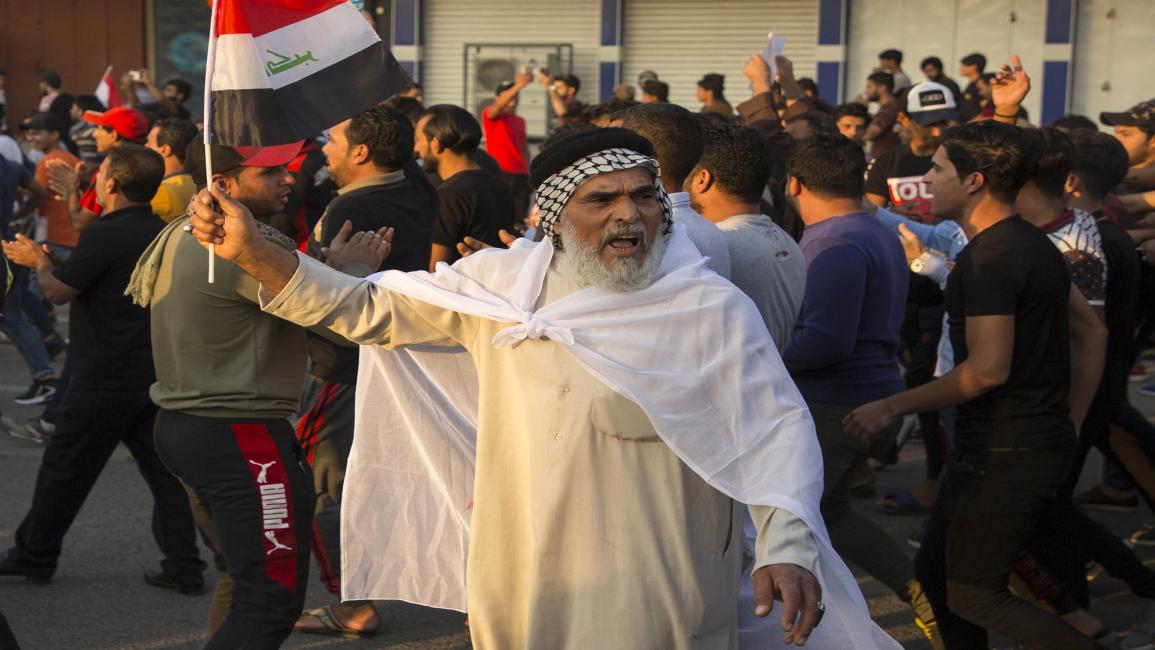 مظاهرات العراق (حسين فالح/فرانس برس)