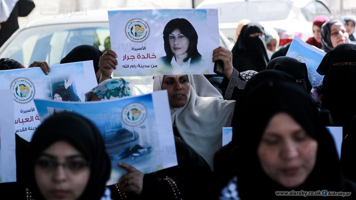 نساء غزة يتضامن مع الأسيرات في يوم المرأة