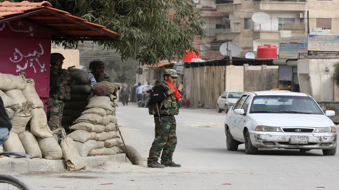 حاجز للجيش السوري في دمشق(لؤي بشارة/فرانس برس)