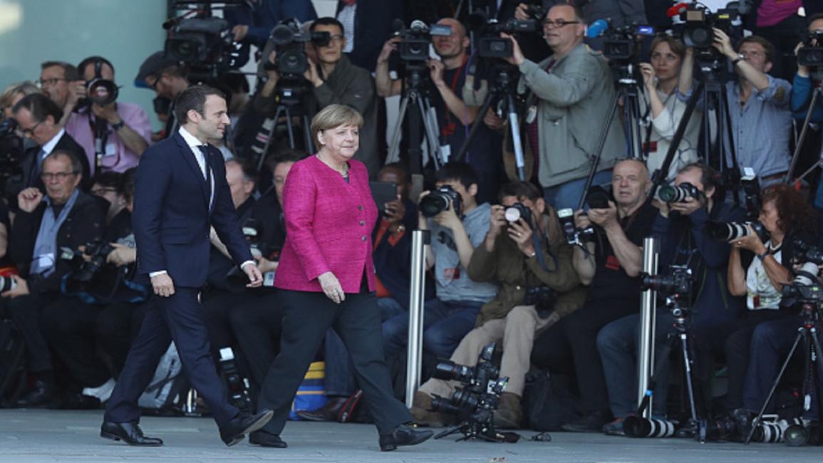 Macron and Merkel) Sean Gallup/Getty)