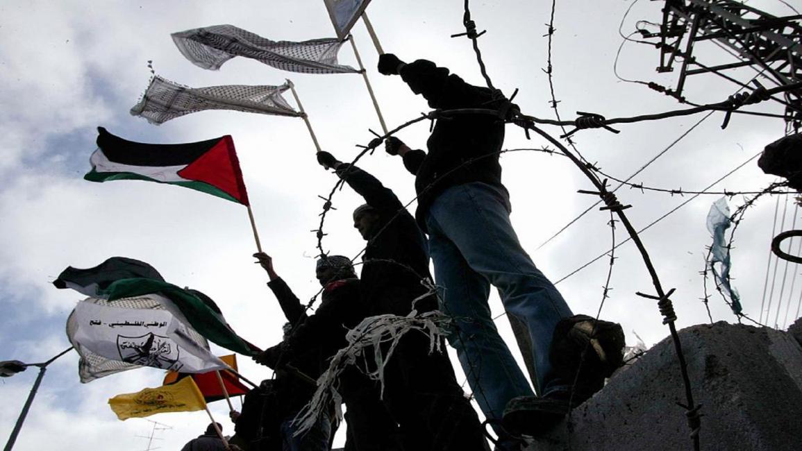 رفع العلم الفلسطيني(أورييل سيناي/Getty)