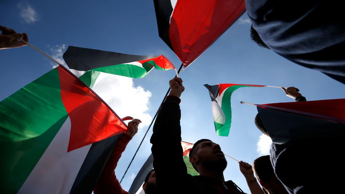 فلسطينيون يتظاهرون ضد قانون الضمان/مجتمع(عباس موماني/ فرانس برس)