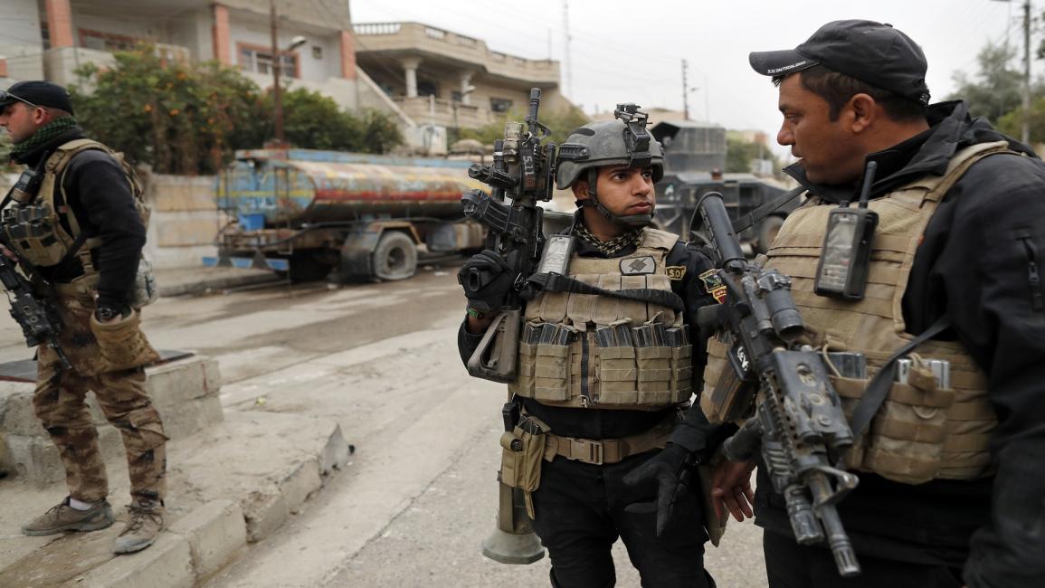 العراق/إجراءات أمنية بالجانب الأيسر المحرر بالموصل/توماس كويكس/فرانس برس
