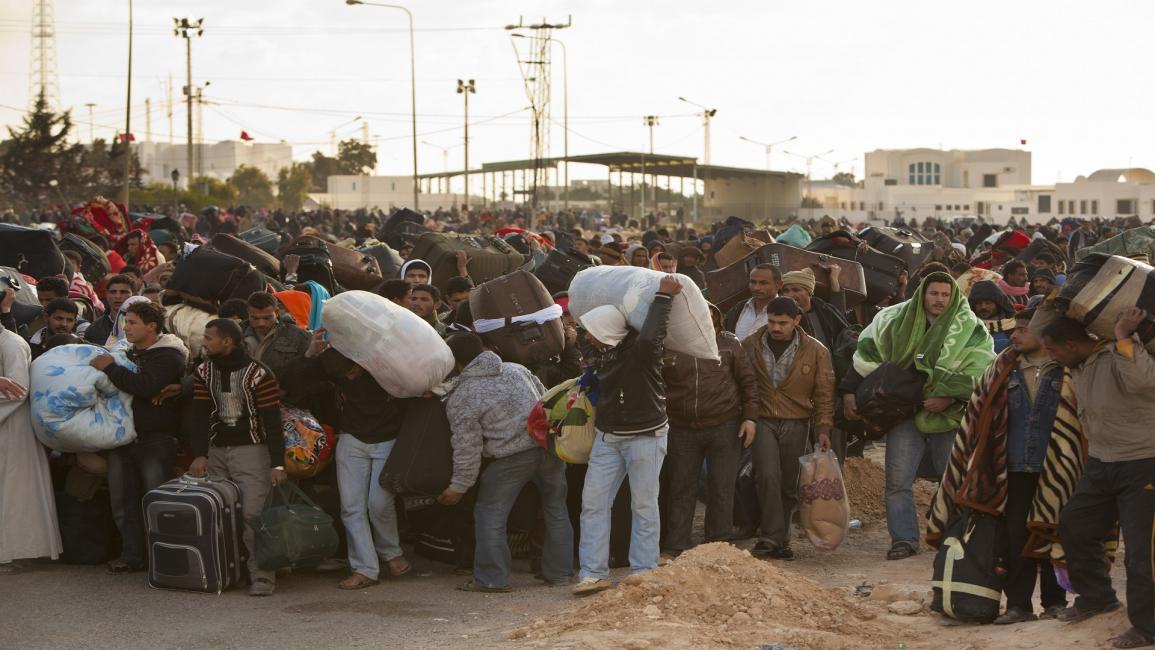 تعرض عمال تونس في ليبيا لأزمات متكررة (باتريك روبرت/Getty)