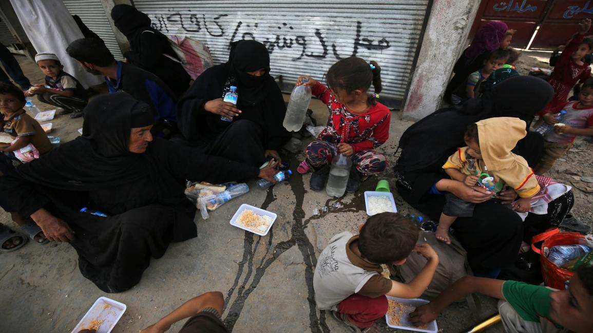 أطفال ونساء في الموصل (أحمد الربعي/ فرانس برس)