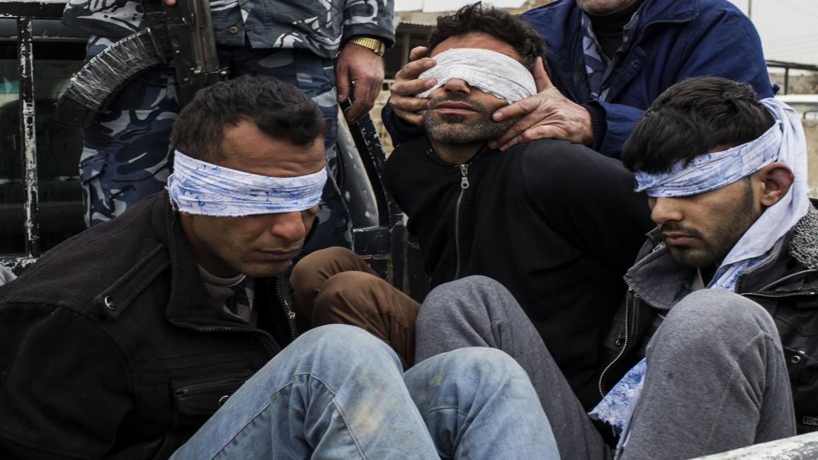 مليشيا تعتقل عراقيين- فرانس برس
