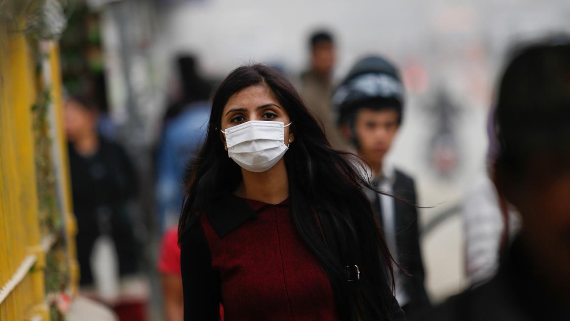 امرأة وتلوث هواء في نيبال - مجتمع
