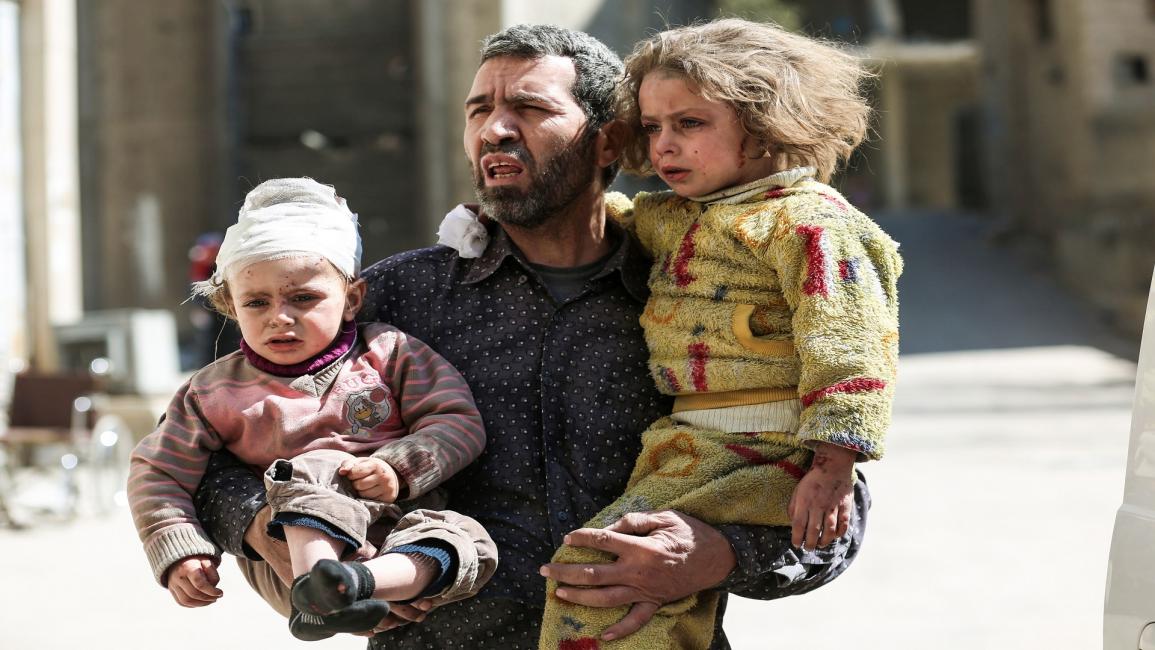 أطفال مصابون في الغوطة الشرقية (عامر المهيباني/فرانس برس)